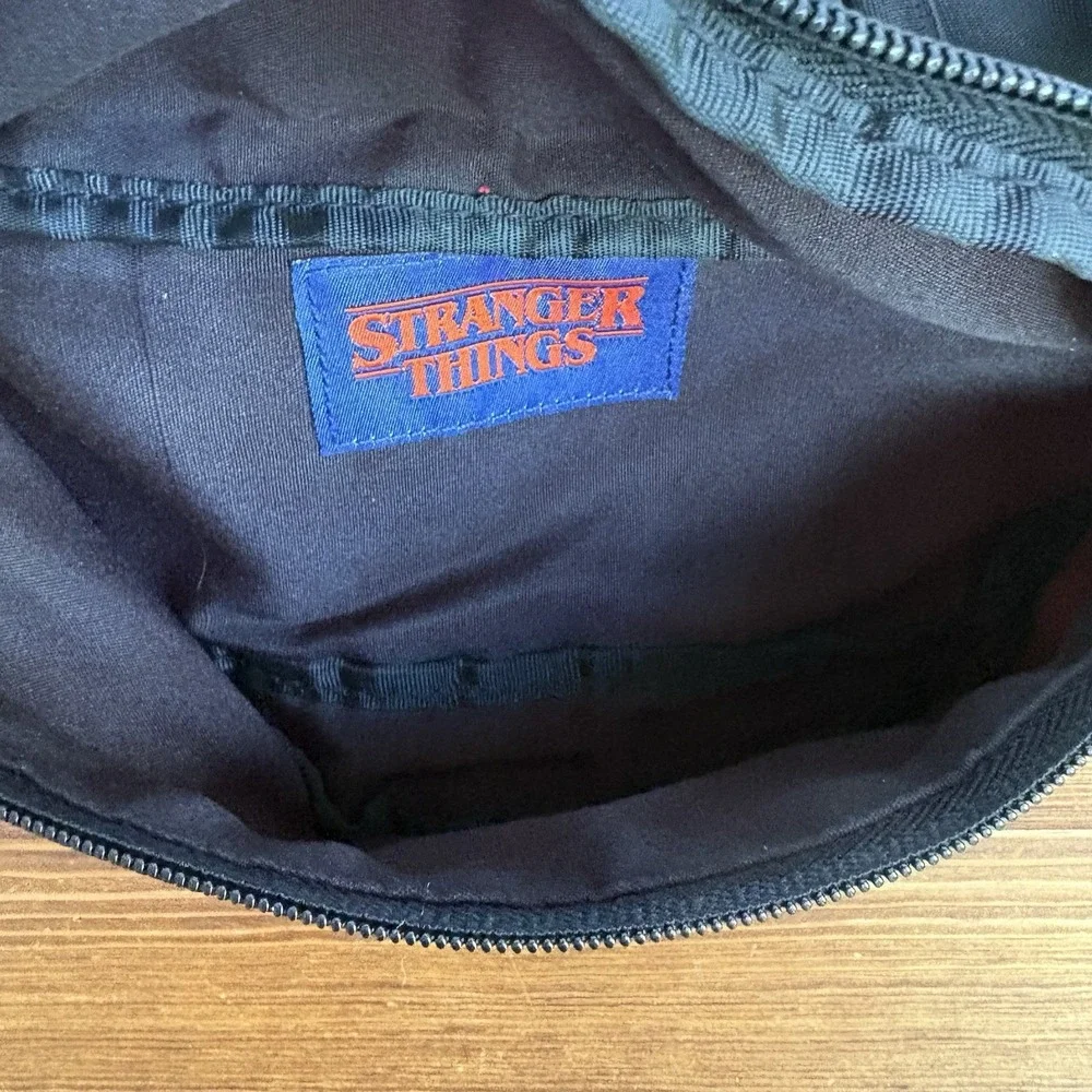 Stranger Things Hawkins 1985 Fanny Pack & Hawkins Horrors Book Lot Netflix